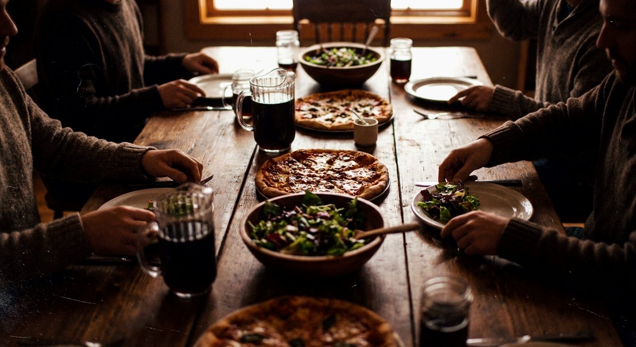 A catering spread of pizzas and salads